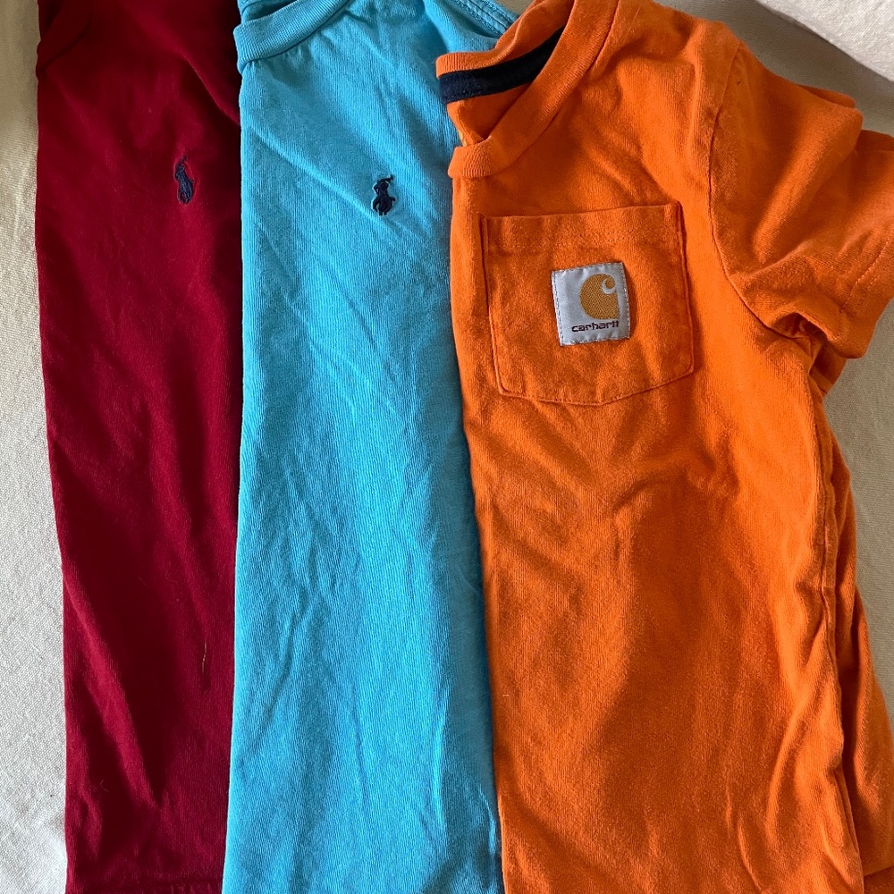2 5T polo shirts and 1 Orange Carhartt shirt